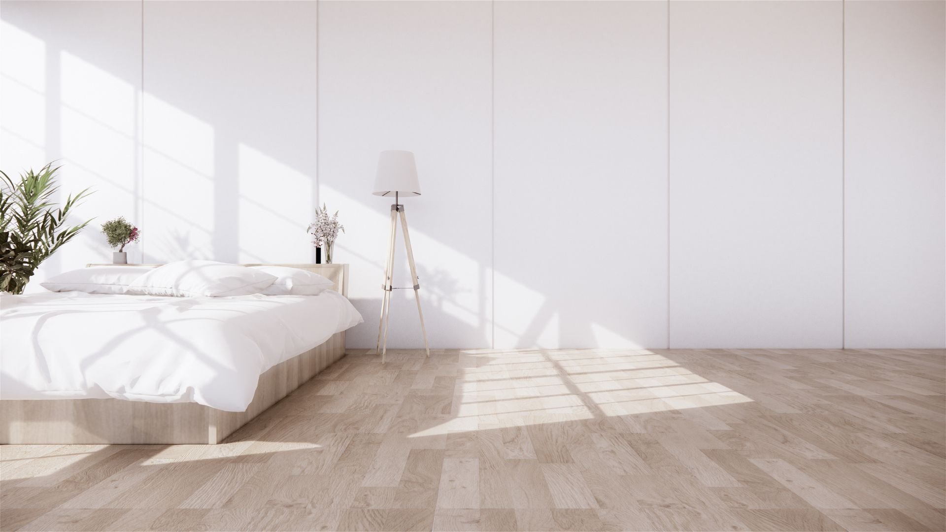 Minimalist white bedroom with wooden floor and tripod lamp