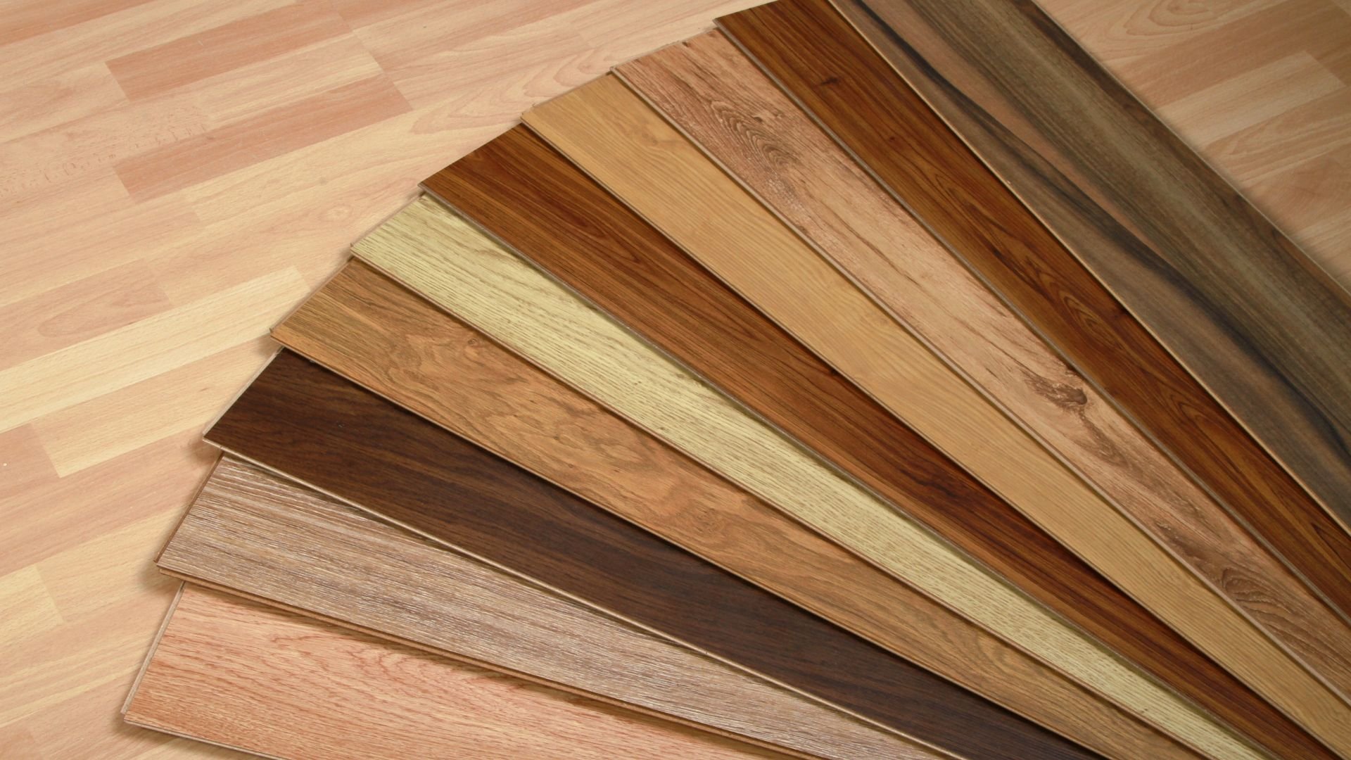 Variety of wooden flooring samples in different shades and textures